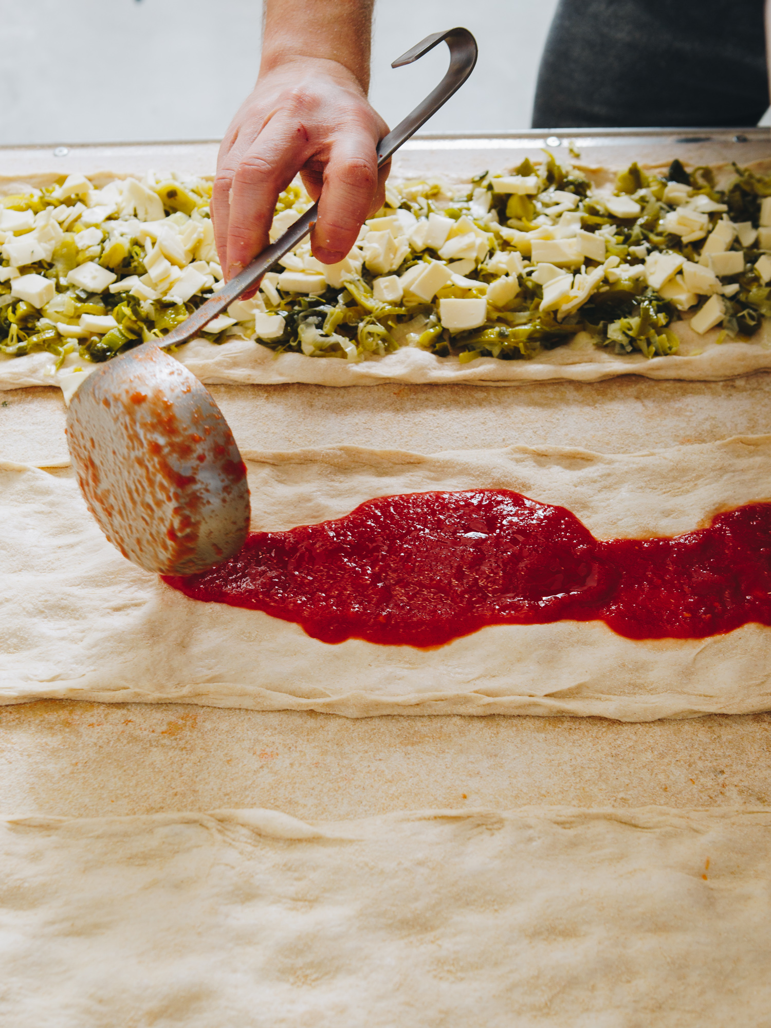 Spécialités salées Pizze et focacce à la coupe, fait à partir d'ingrédients de qualité. Fabrication dans notre Boulangerie Farina en Corse.